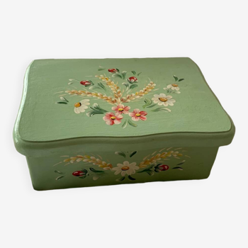 Wooden box painted light green with flowery flowers