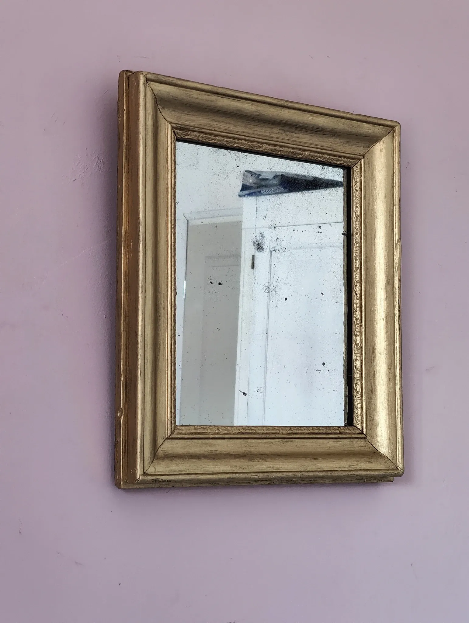 Small Art Deco mirror with a gilded wooden frame.