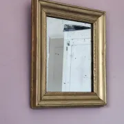 Small Art Deco mirror with a gilded wooden frame.