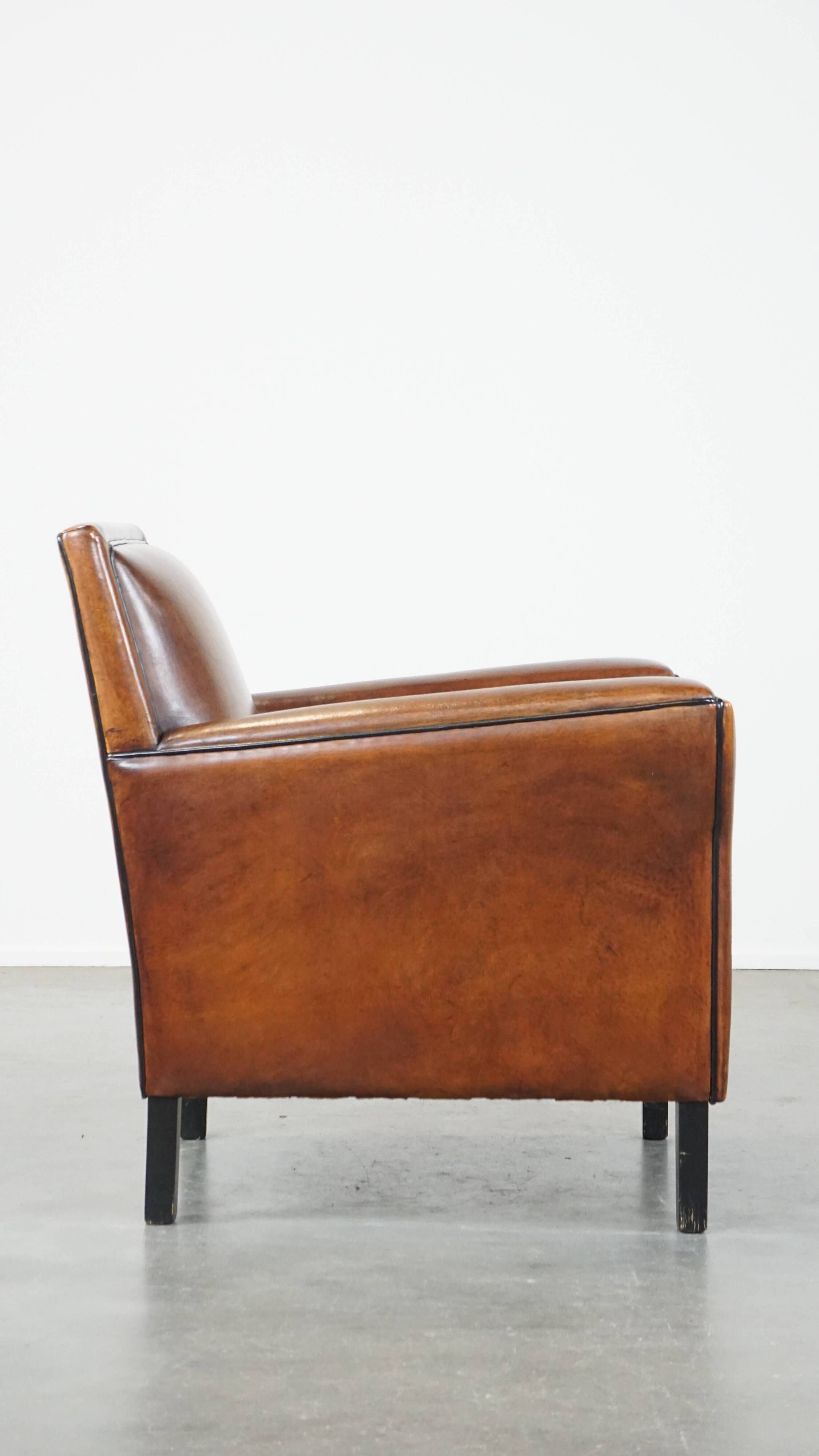 Cognac-colored sheep leather Art Deco design armchair finished with piping