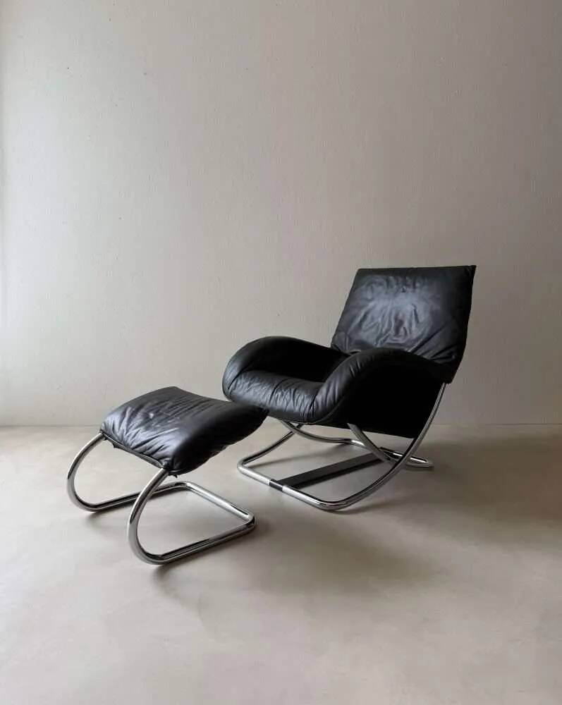 Swiss lounge chair with ottoman by Robert Haussmann from the 1980s.