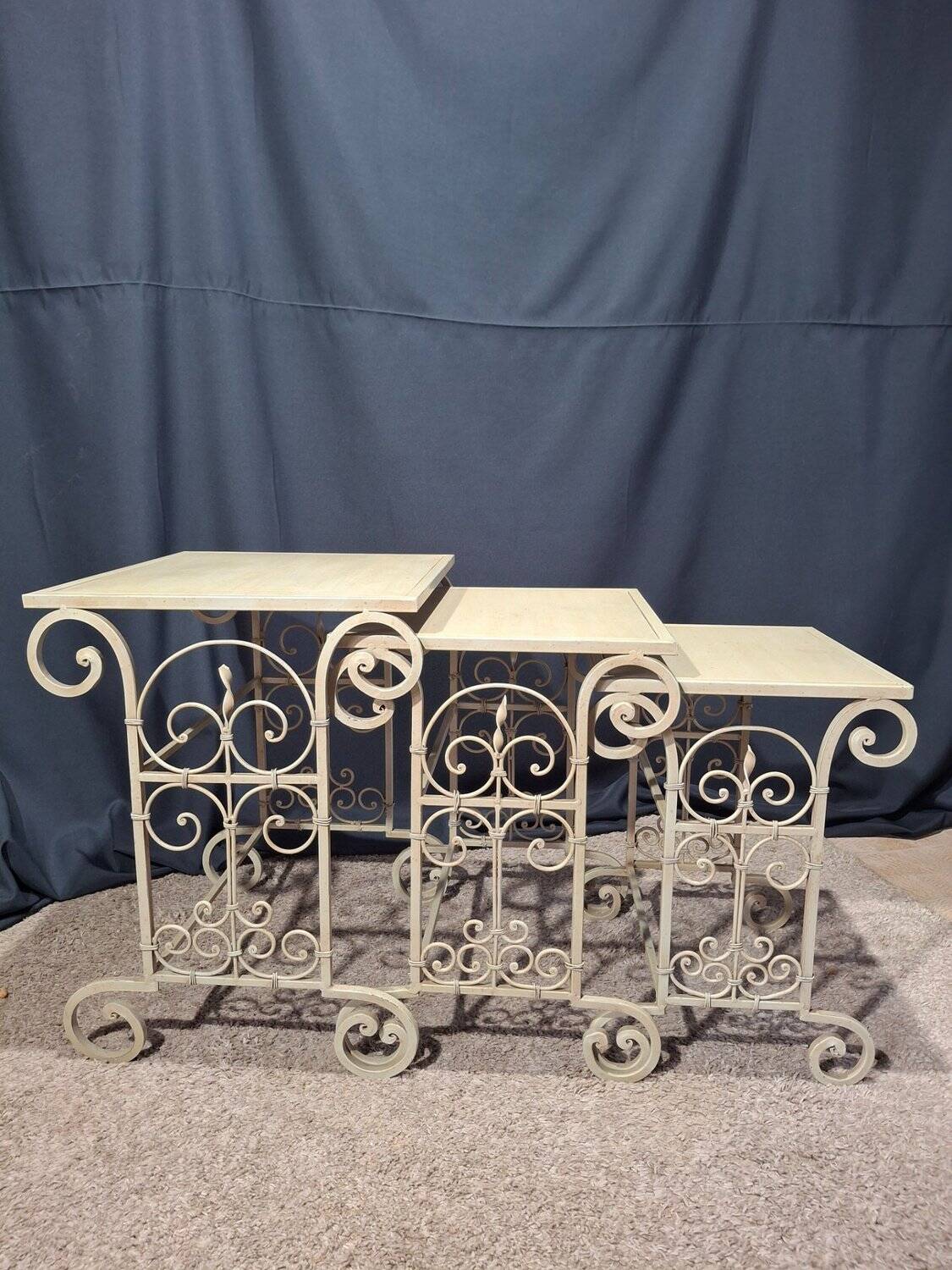 Nesting tables in patinated iron.