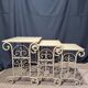 Nesting tables in patinated iron.