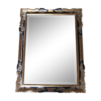 Miroir biseauté cadre bois noirci et doré - milieu XXe siècle 64x84cm