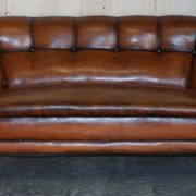 Victorian Chesterfield leather canapé with oak lion claw feet.
