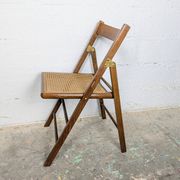 Folding chair with a cane seat