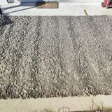 Rug in the style of a designer.