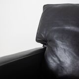 Pair of armchairs in black leather and chrome metal. 1970s.