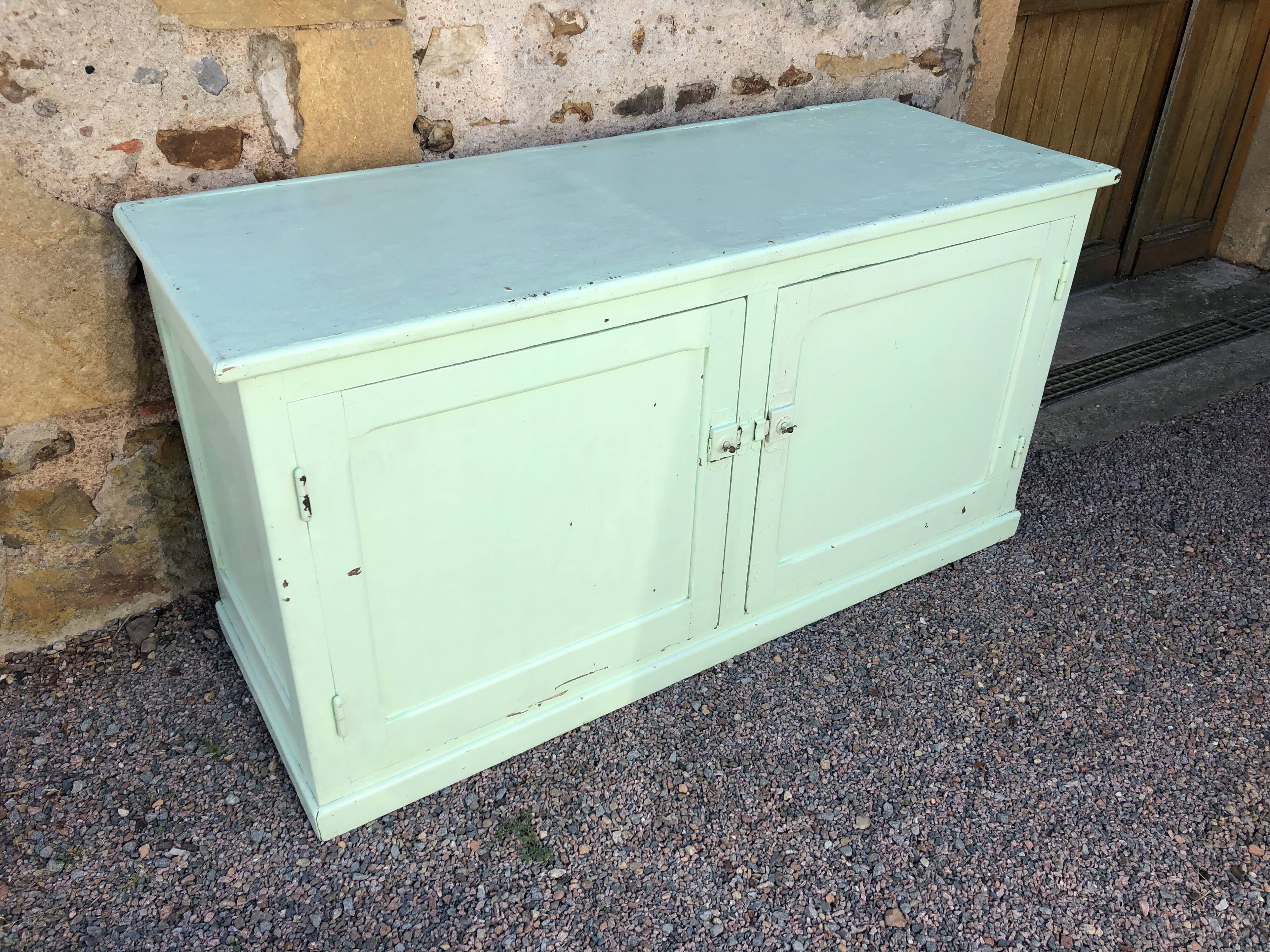 Low green patinated furniture