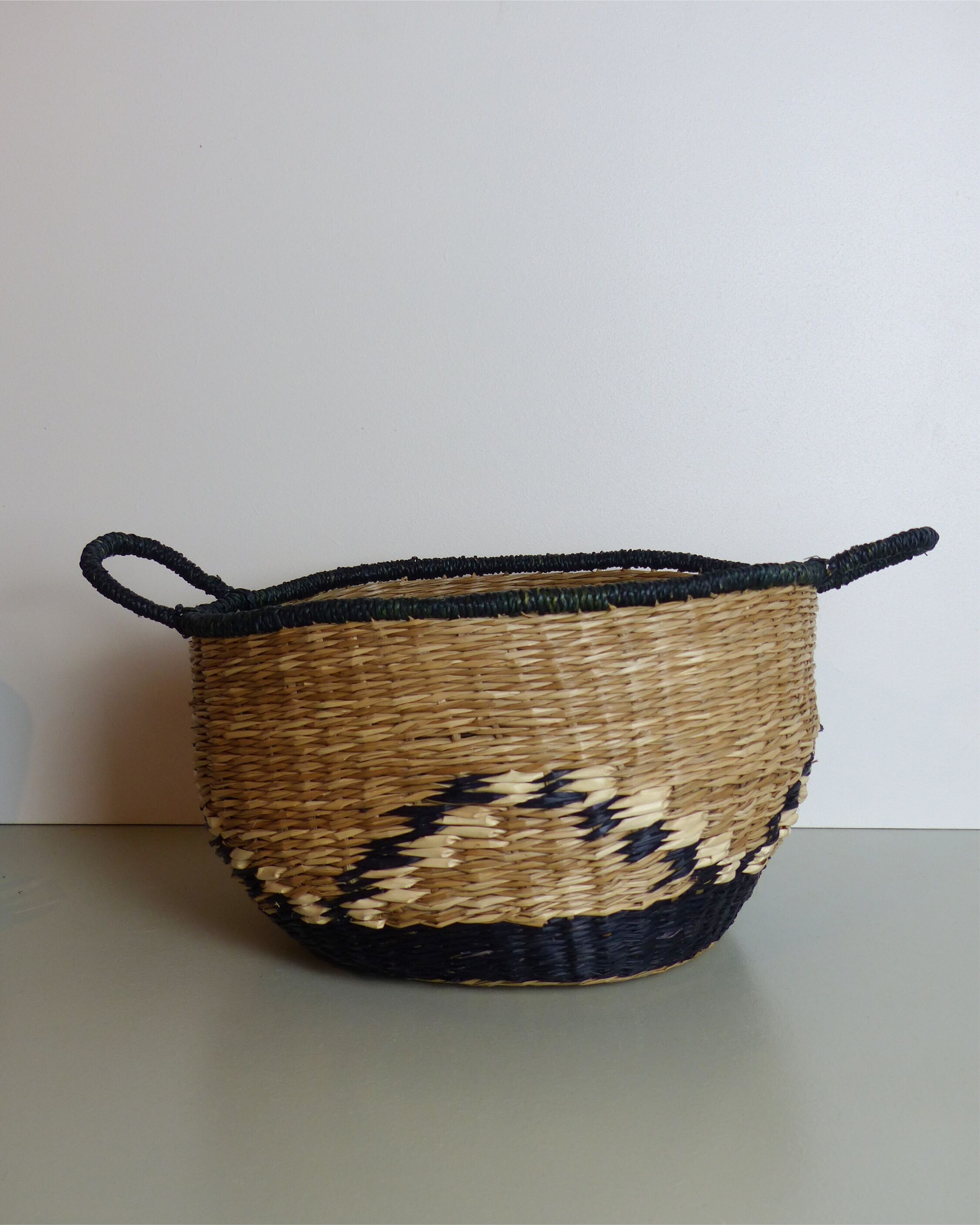 Vintage basket in black and beige raffia