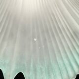 Frosted glass flower pendant with a water green edge.