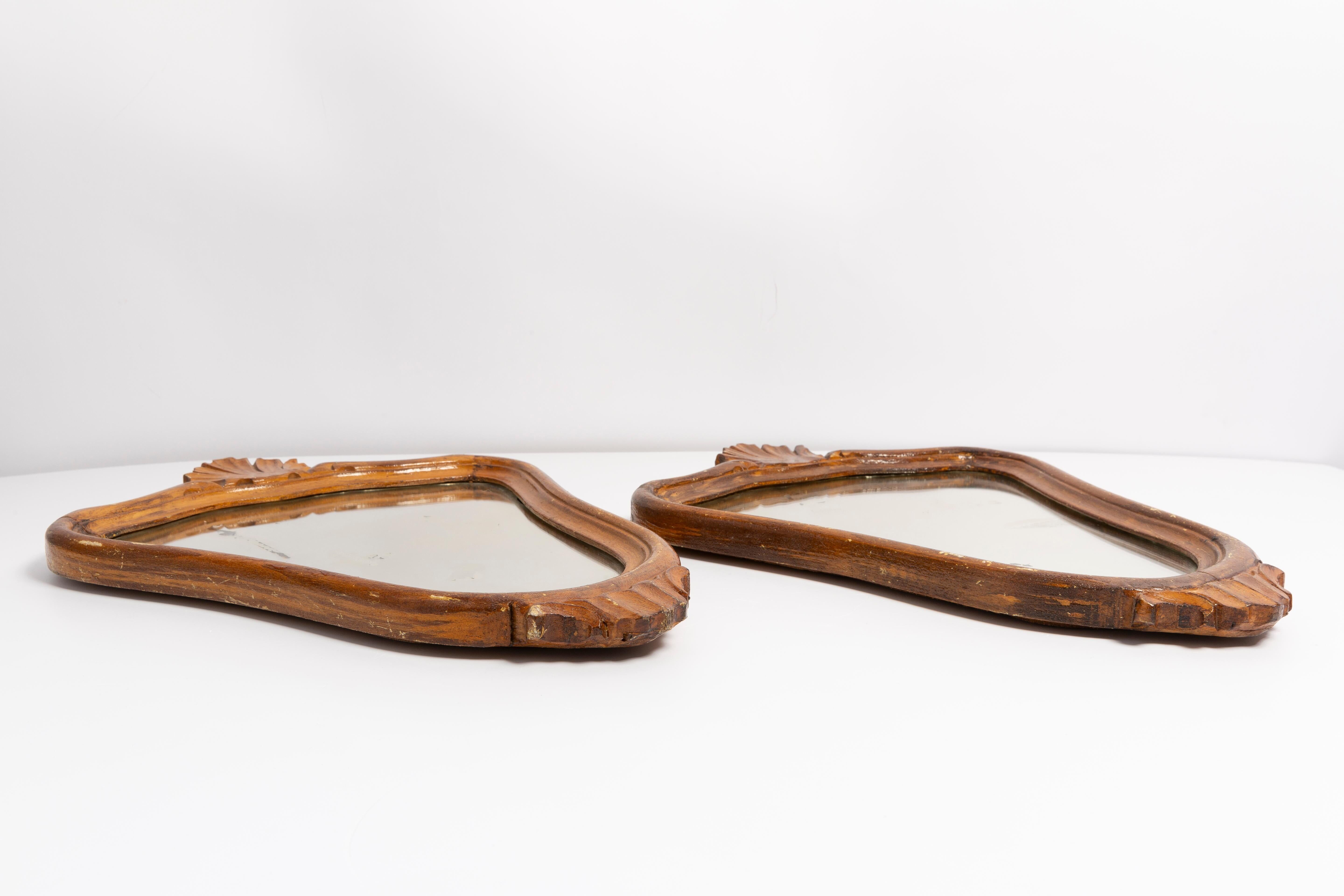 Pair of vintage Mid-Century decorative mirrors in a gold frame, Italy, 1960s.