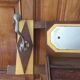Vintage Art Deco wall coat rack in two-tone wood with engraved mirror.