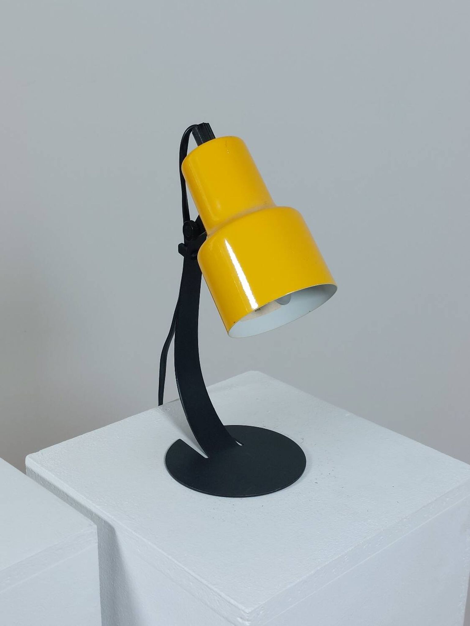 A pair of well-designed minimalist bedside lamps.