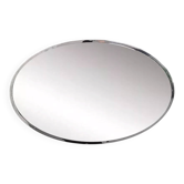 Oval mirror from the 1960s with a chrome frame.