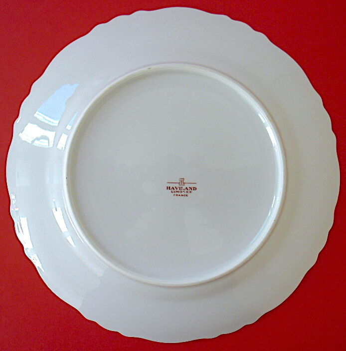 Suite of twelve table plates in white porcelain, golden lip