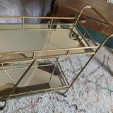 Vintage style serving trolley in gold metal