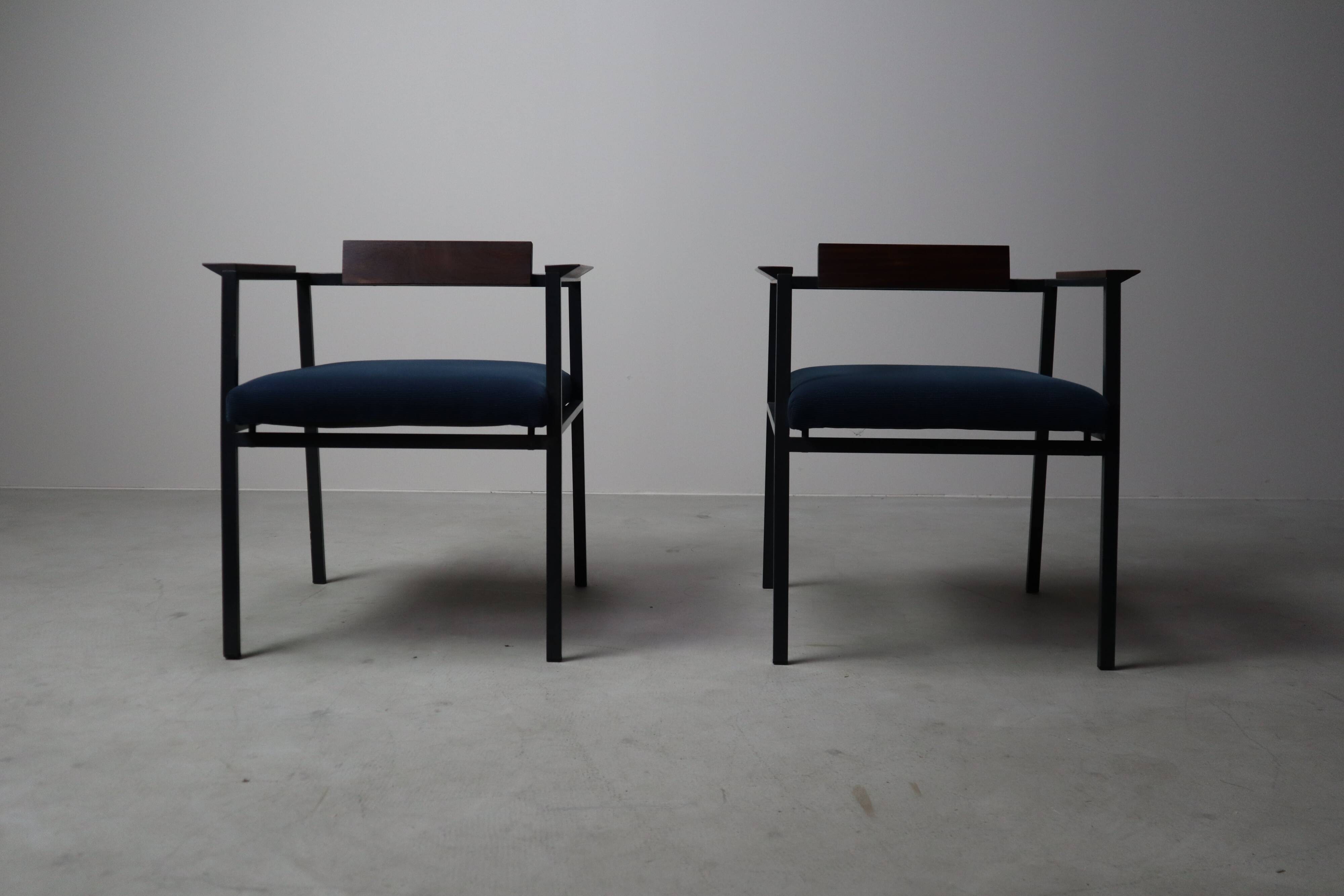 Pair of Postmodern armchairs in steel and mahogany, 1970s
