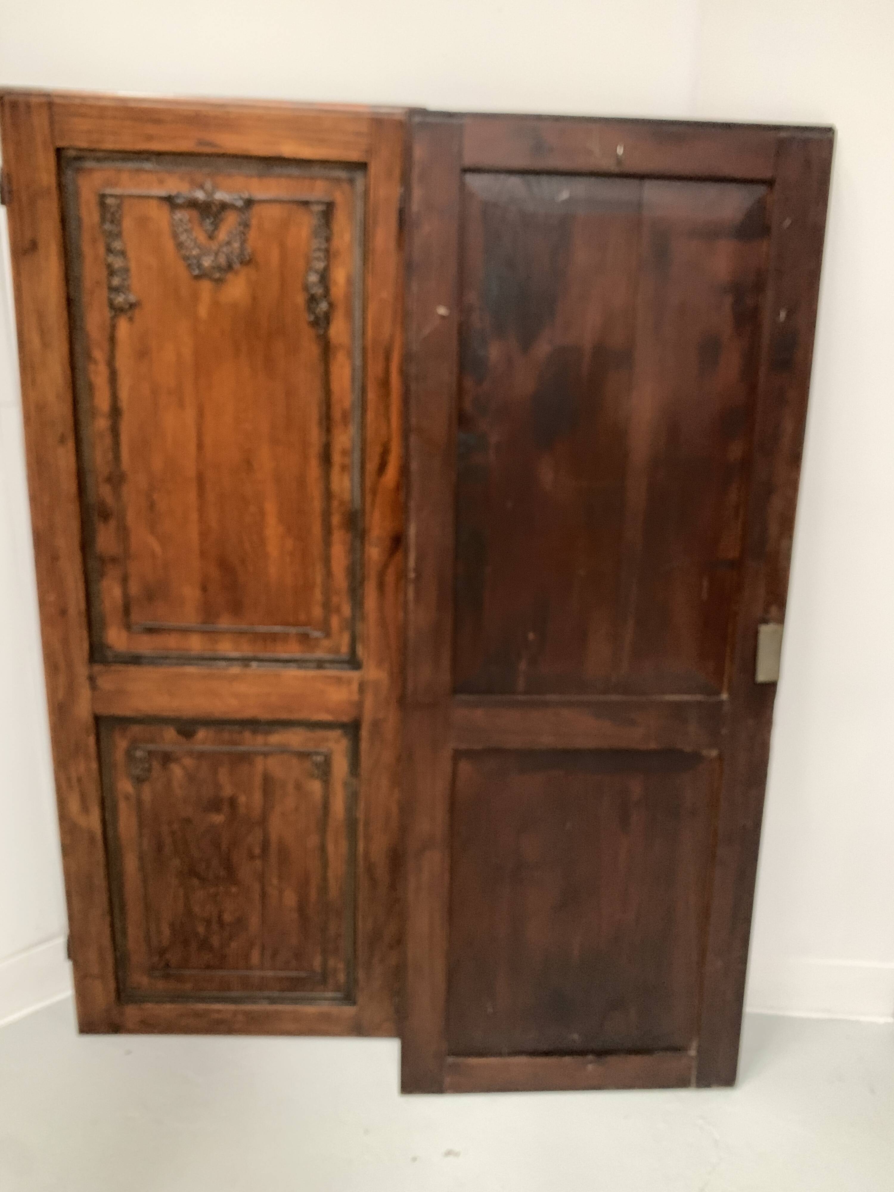Double cupboard doors in carved oak, 20th century