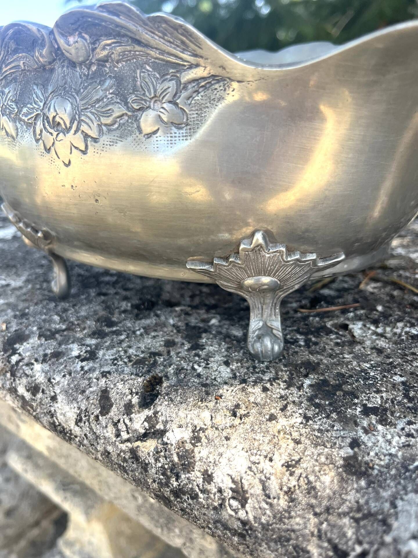 Footed pewter champagne cooler on claw feet with floral relief