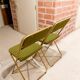 Two green and golden chairs