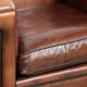 Sleek sheepskin Art Deco design armchair with black piping