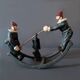 Vintage toy "Painted cast iron clown seesaw" from the 1930s
