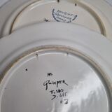 Pair of Henriot Quimper flat plates decorated with rooster and flowers