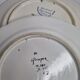 Pair of Henriot Quimper flat plates decorated with rooster and flowers