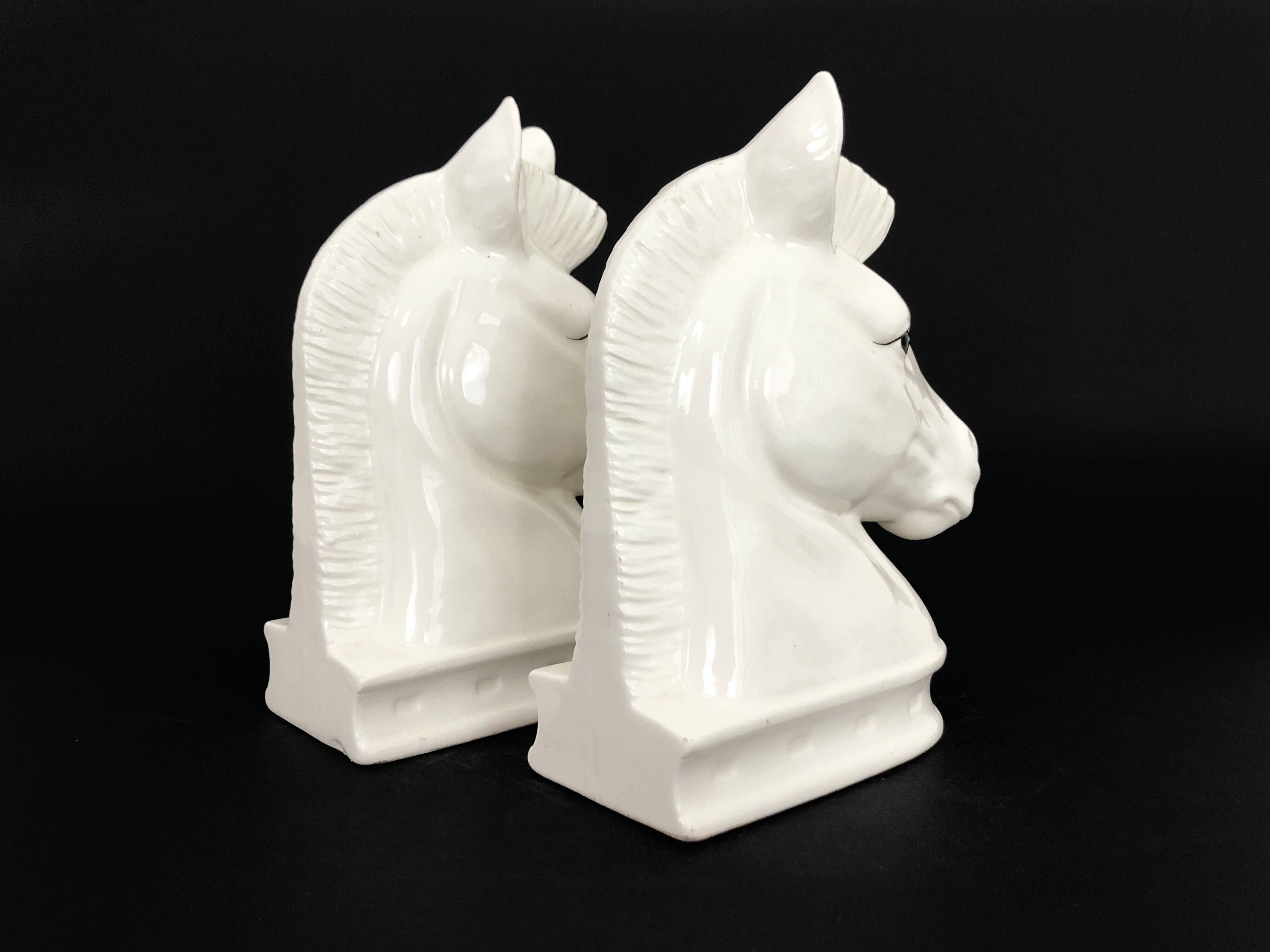 Pair of vintage white ceramic weighted horse bookends. 80 years