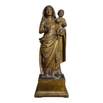 Ancient statue of the Virgin and Child in polychrome and gilded carved wood.