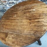 Round console table with folding shutters on copper wheels