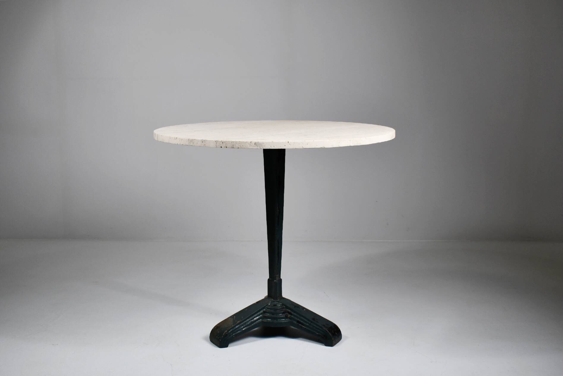 Vintage travertine bistro/dining table with metal base. (B)