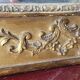 Antique Louis Philippe style gilded mirror decorated with floral motifs