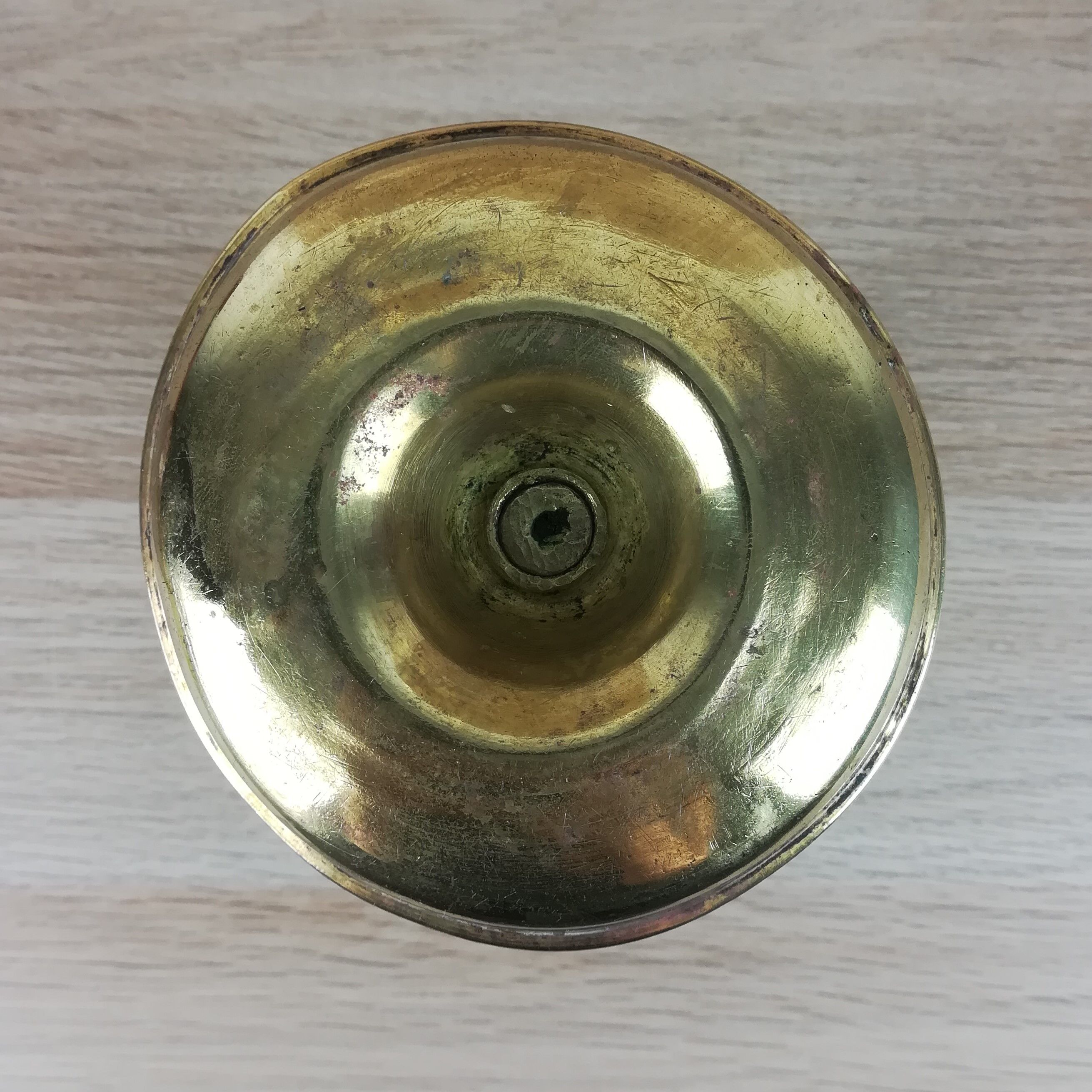 Brass pusher candle holder