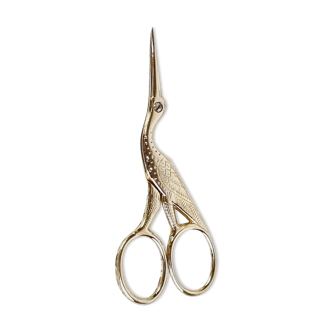 Sewing chisel in golden metal bird