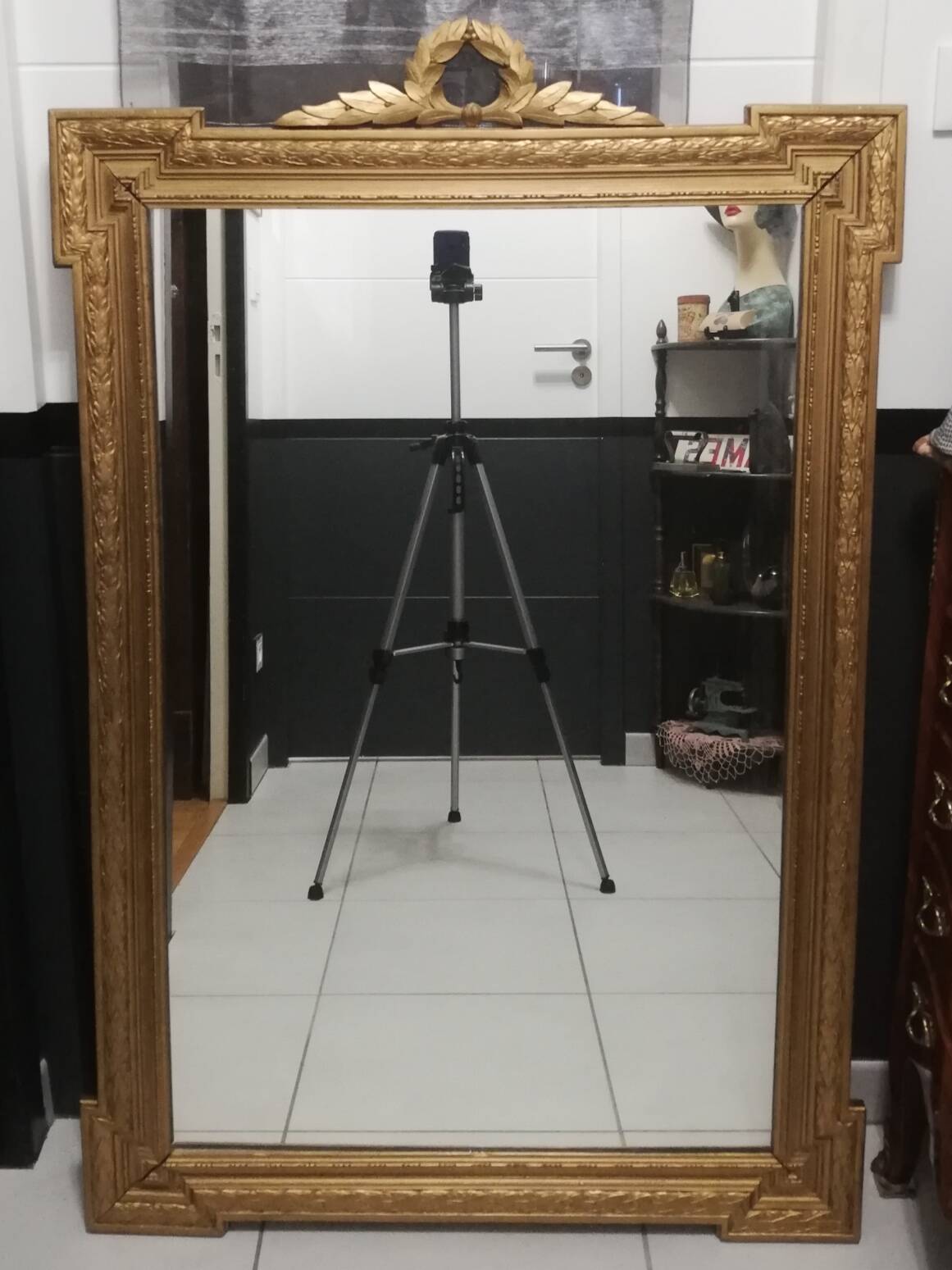 Carved wooden pediment mirror