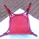 Fauteuil vintage en rotin rouge