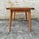 Oak table has two vintage extensions