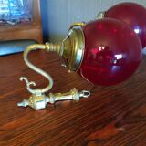 Pair of vintage brass wall light and cherry red globe