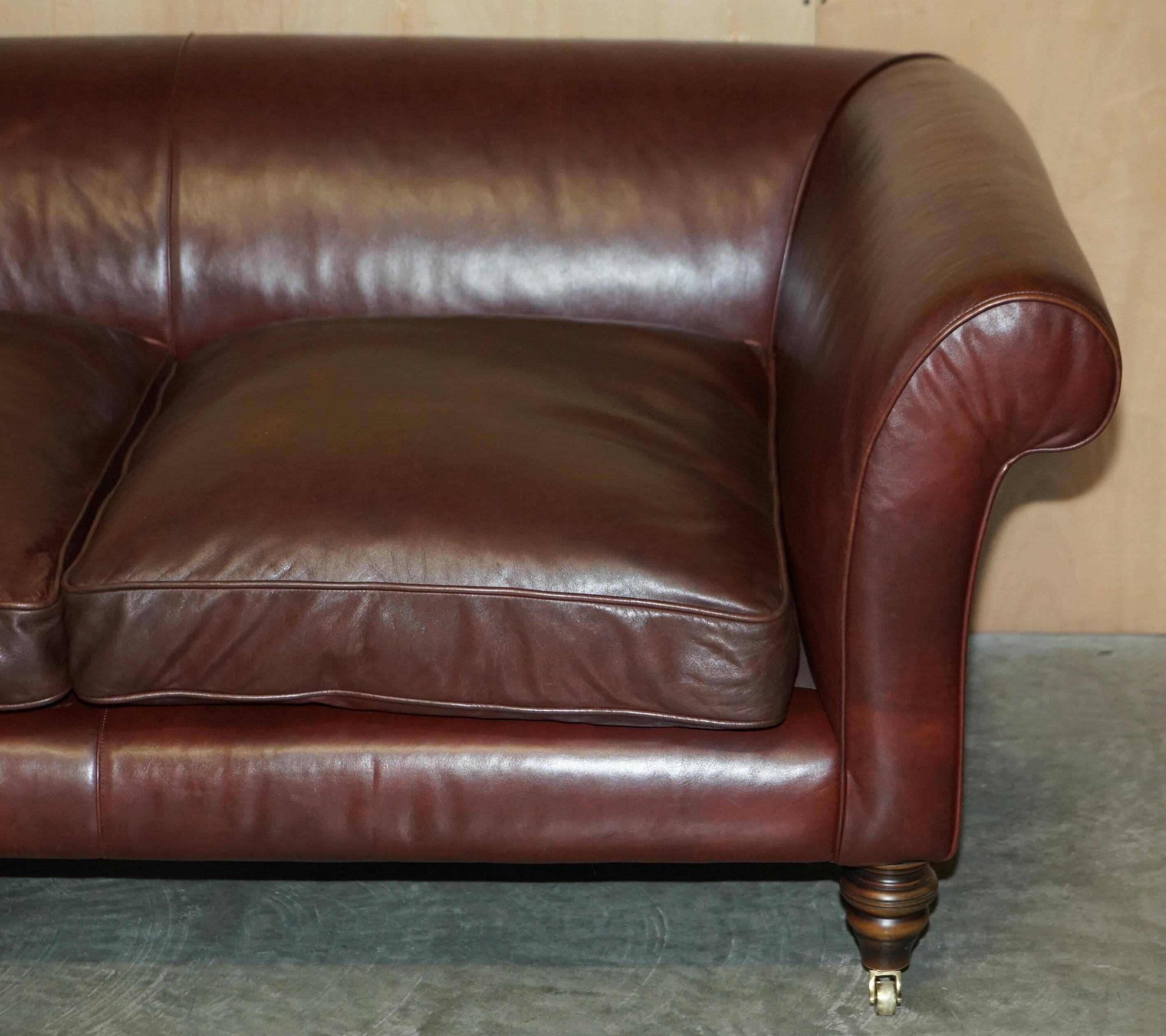 Vintage Art Deco leather sofa, three-seater, feather cushions.