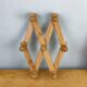 Wooden accordion coat rack