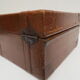 Rectangular wooden suitcase covered with leather