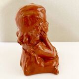 Bust of a pensive child in plaster