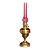 Vintage brass oil lantern with decorative base and transparent glass funnel stamped L B Brand Delay 4399.