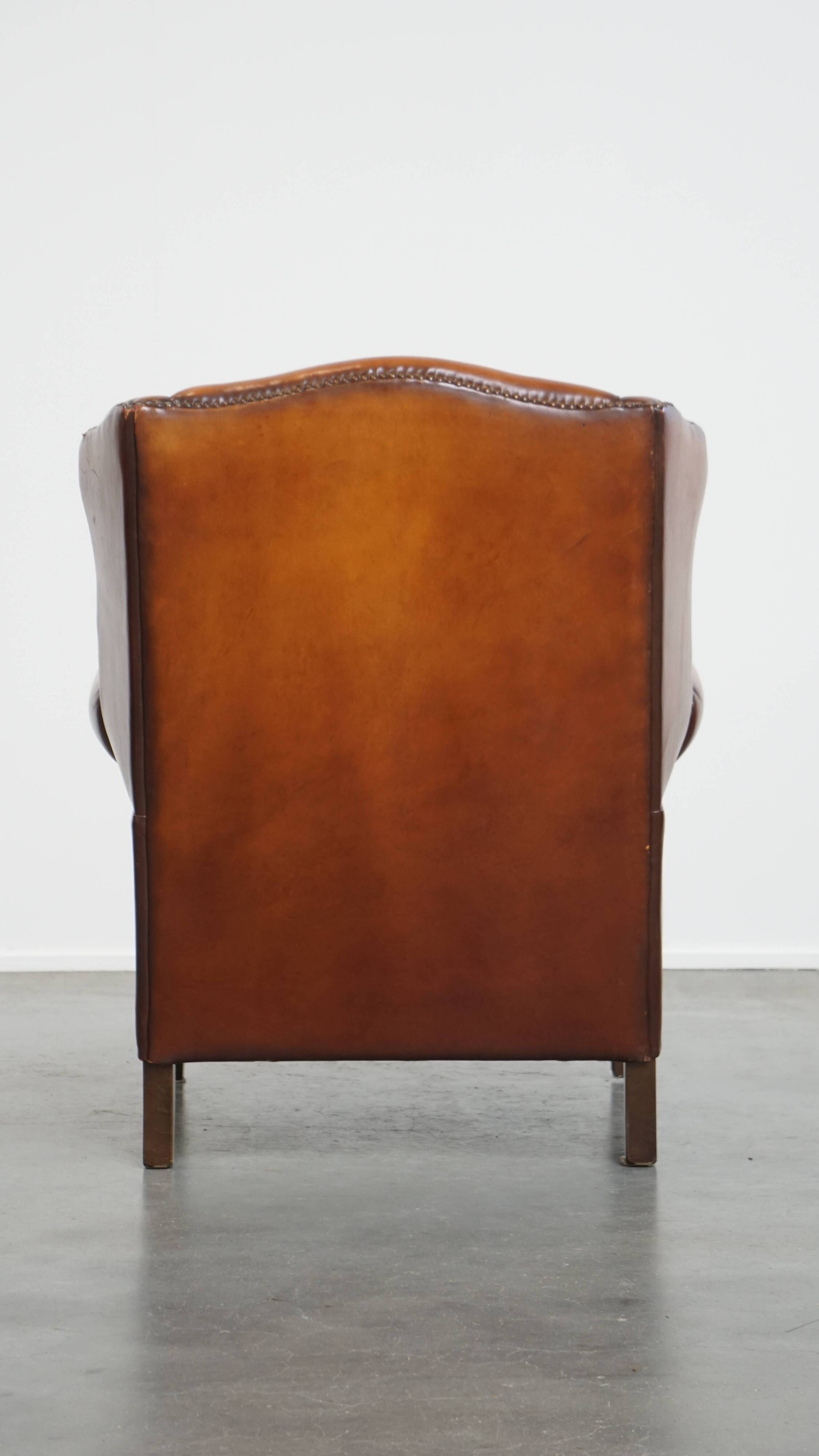 Fauteuil à oreilles en cuir de mouton