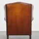 Fauteuil à oreilles en cuir de mouton