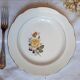 Flat earthenware plates with gilded edges