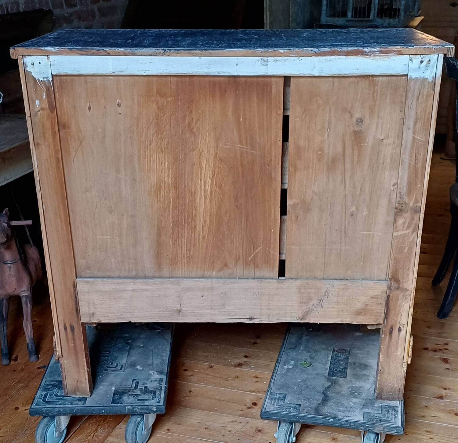 Antique piece of furniture with a grey patina.