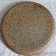 Round dish in varnished sandstone